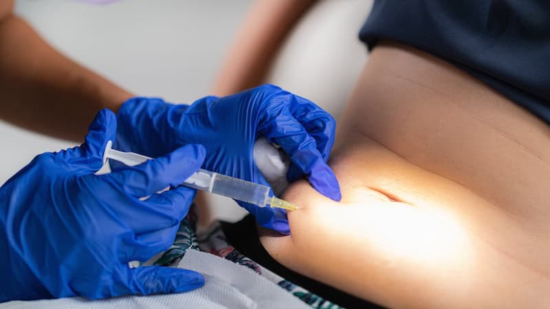 Patient receiving Lemon Bottle Fat Dissolving injection concept photo