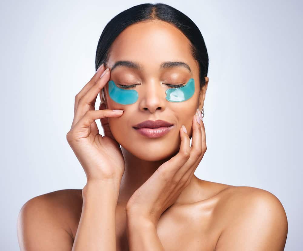 Woman with hydrating under eye patches polynucleotide treatment concept photo